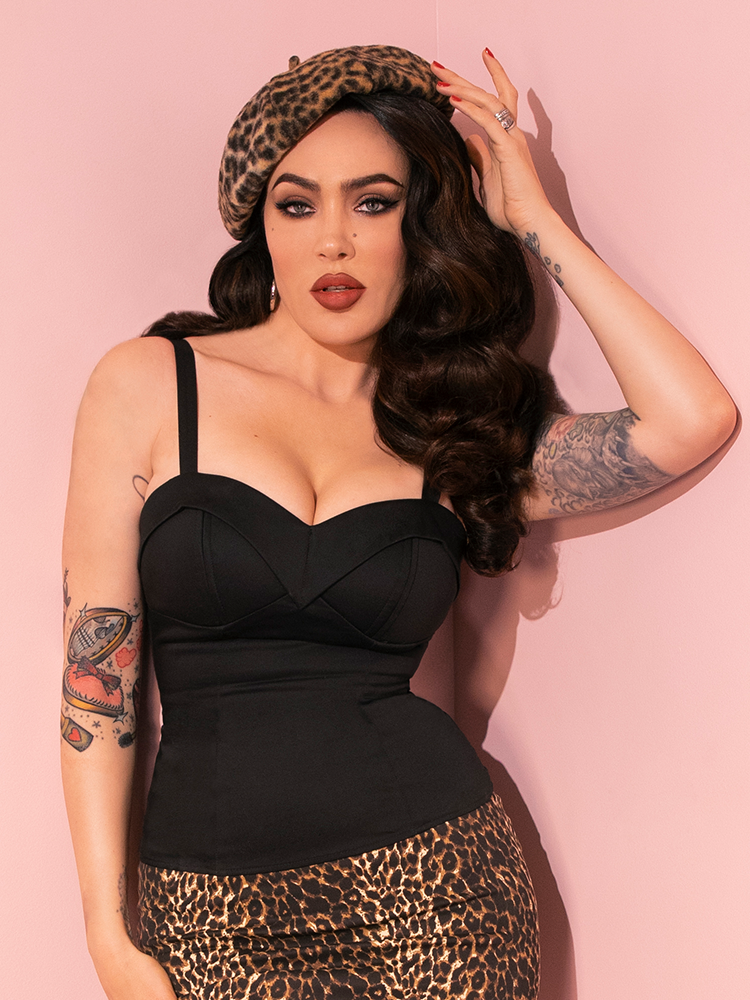 Micheline Pitt brings the retro-inspired Maneater Top in Black from Vixen Clothing to life with her dynamic poses and timeless elegance.