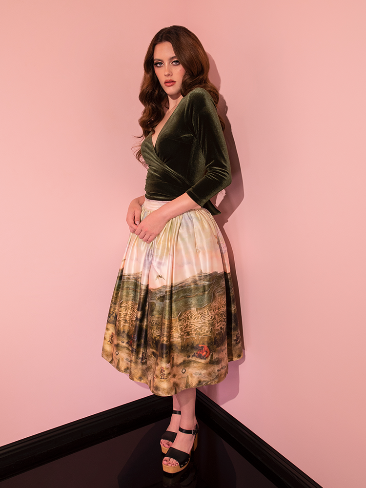 In a resplendent fashion moment, the stunning model graces the scene wearing the LABYRINTH™ Renaissance Skirt in the captivating Labyrinth Watercolor Print, evoking the vintage magic of Vixen Clothing.