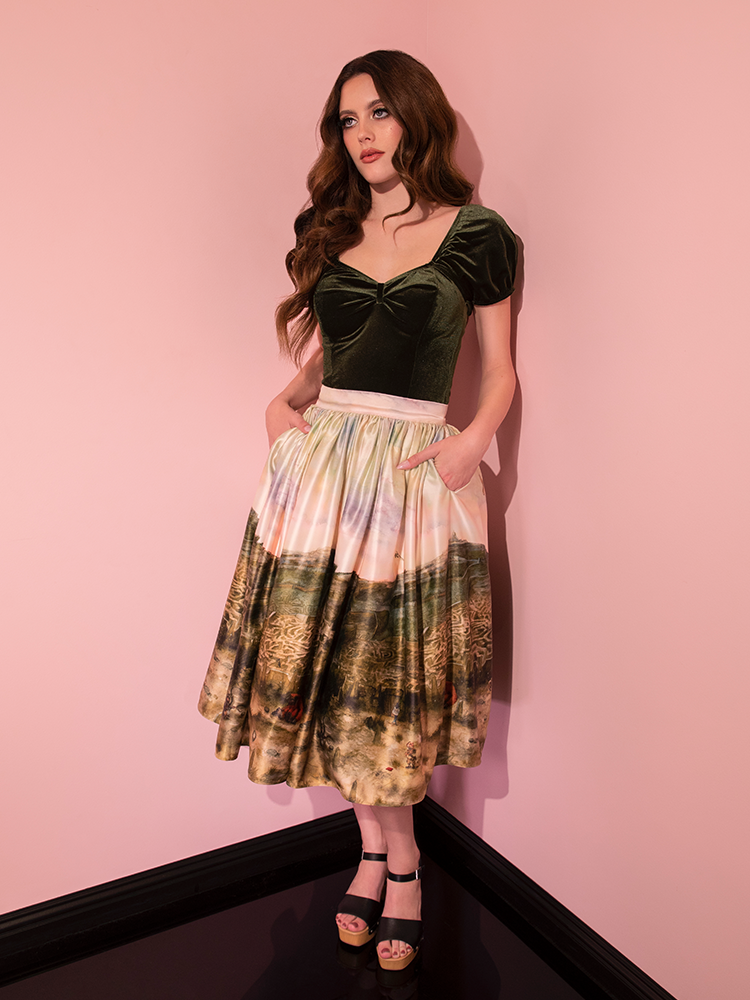 Retro fashion is beautifully redefined as the LABYRINTH™ Renaissance Skirt with Labyrinth Watercolor Print shines brilliantly on this stunning model from Vixen Clothing.