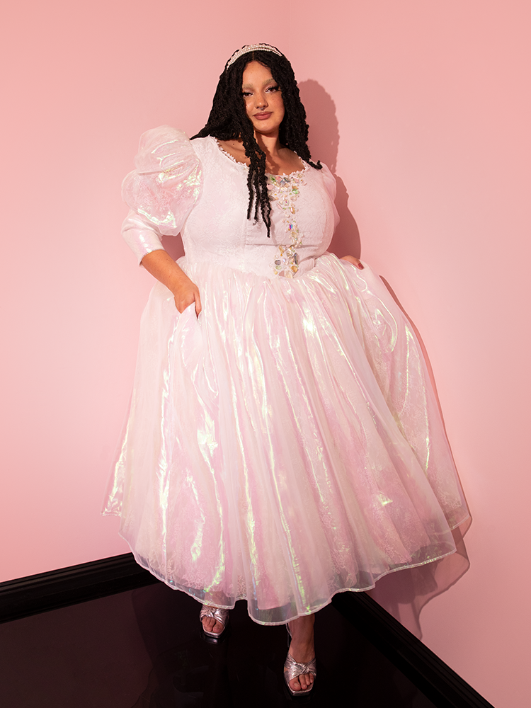 Celebrate the magical allure of the LABYRINTH™ Sarah Goblin Ball Gown in Pearlescent White, a unique gem adorning a beautiful female model, beautifully capturing the essence of Vixen Clothing's vintage artistry.