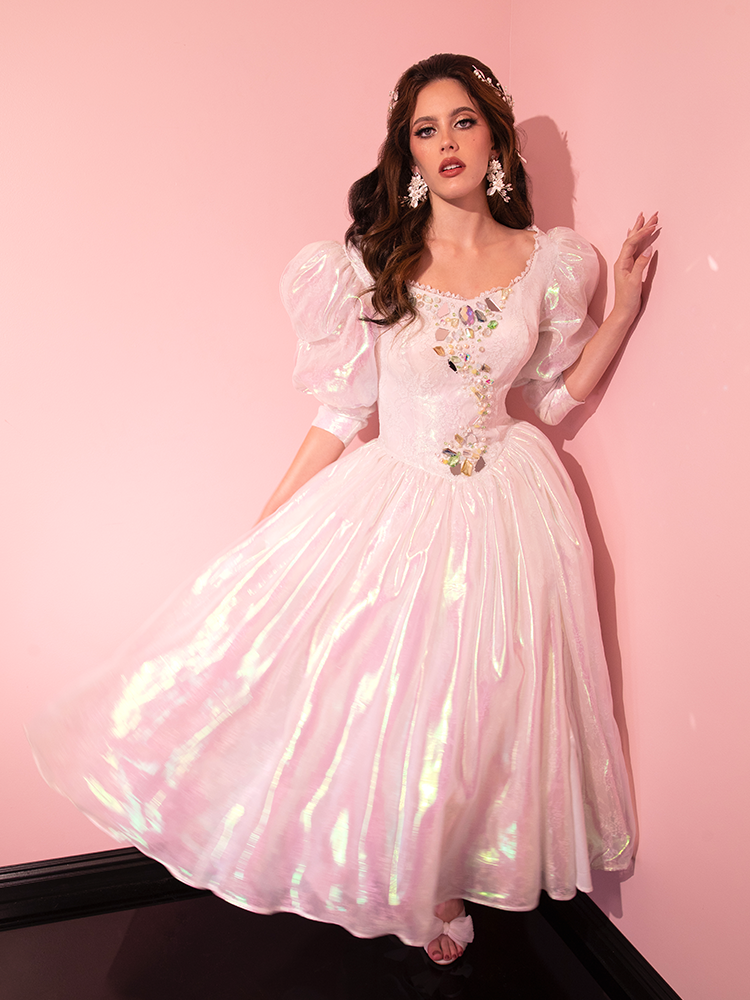 Step back in time and relish the beauty of the LABYRINTH™ Sarah Goblin Ball Gown in Pearlescent White, an enchanting creation sourced from the retro treasure trove of Vixen Clothing.