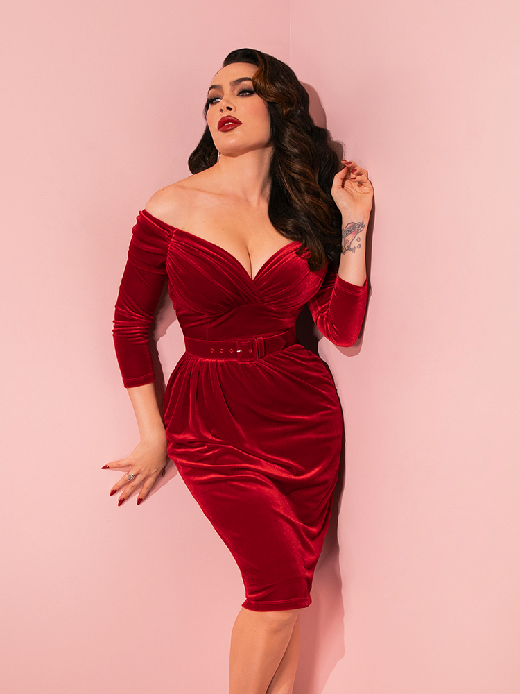 Step into the sophistication of yesteryear with Vixen Clothing's Starlet Wiggle Dress in Ruby Red Velvet. Experience the nostalgia as vintage models bring this retro beauty to life on the runway.