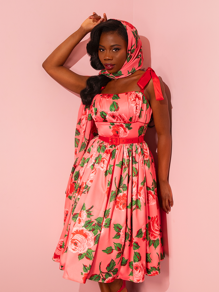 Step back in time with the 1950s Satin Swing Sundress and Scarf in Pink Vintage Roses, a retro masterpiece by Vixen Clothing. Watch as stunning vintage models bring this timeless piece to life.