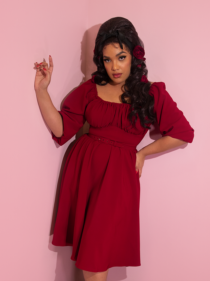 Ashleeta modeling a ruby red retro style dress from Vixen Clothing.