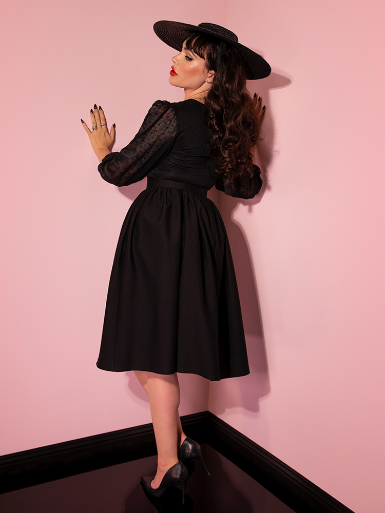 The back of the Frenchie Swing Dress in Black as modeled by Micheline Pitt.