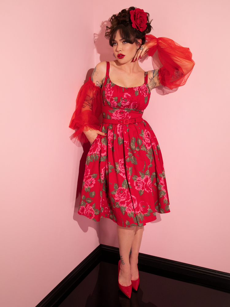 The Ingenue Swing Dress in Vintage Red Rose Print from Vixen Clothing - worn by Micheline Pitt.