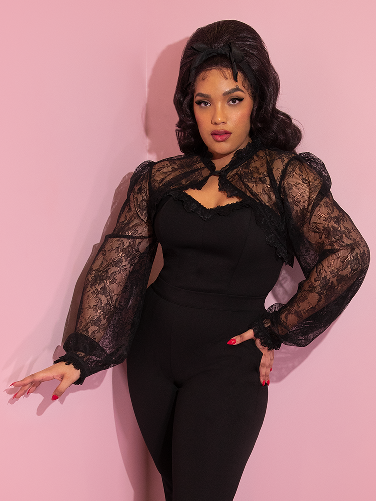 Ashleeta posing in the Vixen Vintage Lace Bolero in Black to complete her retro outfit look.