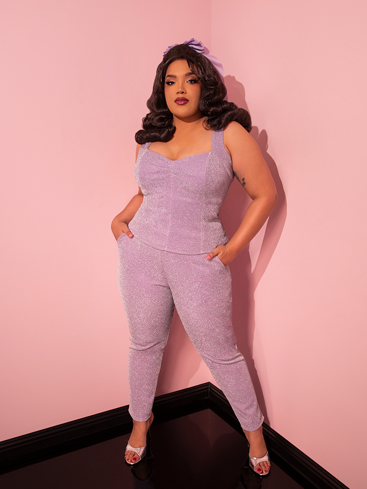 The Cigarette Pants in Lilac Lurex from Vixen Clothing steal the spotlight as the female model confidently shows them off.