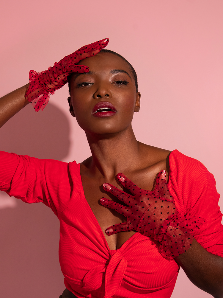 The Mesh Polka Dot Gloves in Red as worn by Brittany of Vixen Clothing.