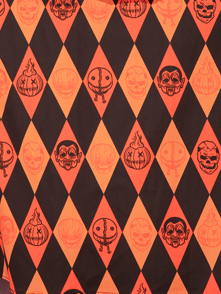 Close up of the print on the TRICK R TREAT™ Sweetheart Swing Dress in Halloween Harlequin Print .