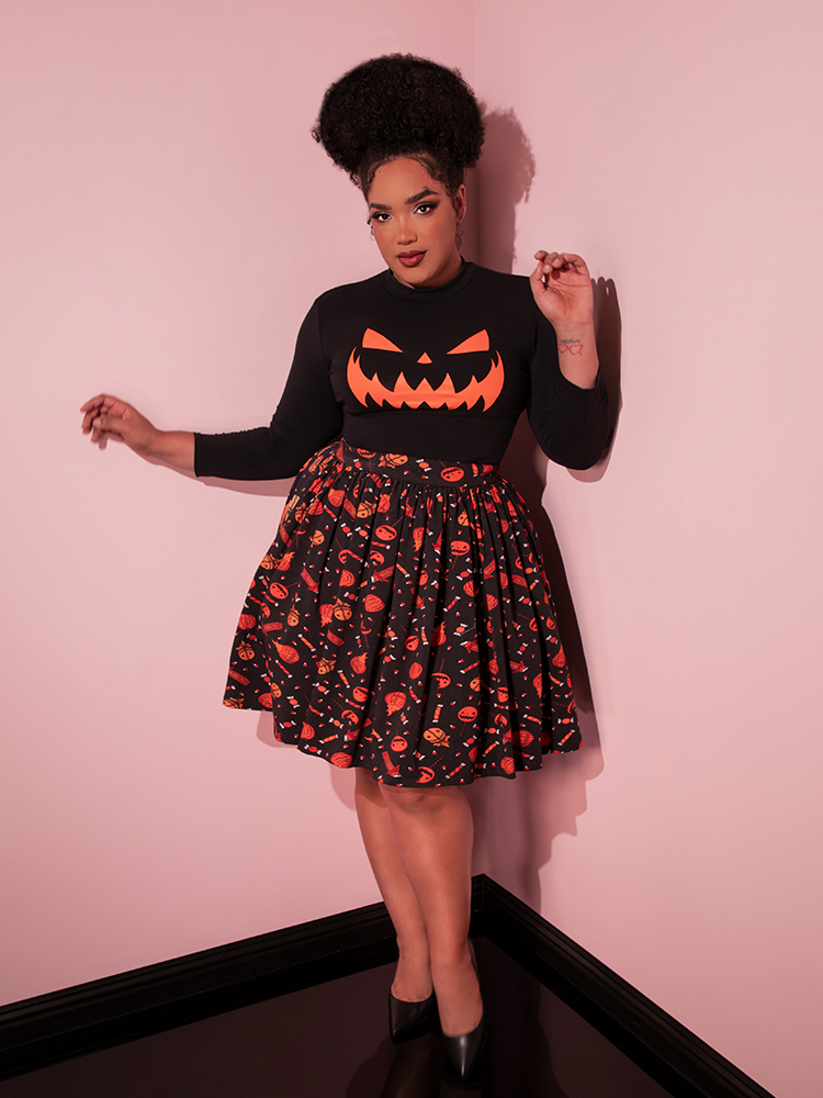 The TRICK R TREAT™ Skater Skirt in Candy Corn Novelty Print being worn by female model.