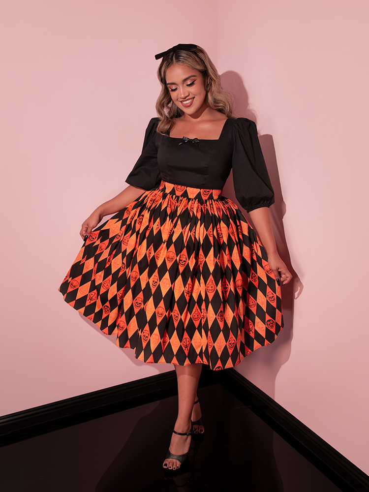 The TRICK R TREAT™ Swing Skirt in Halloween Harlequin Print from retro clothing brand Vixen Clothing.