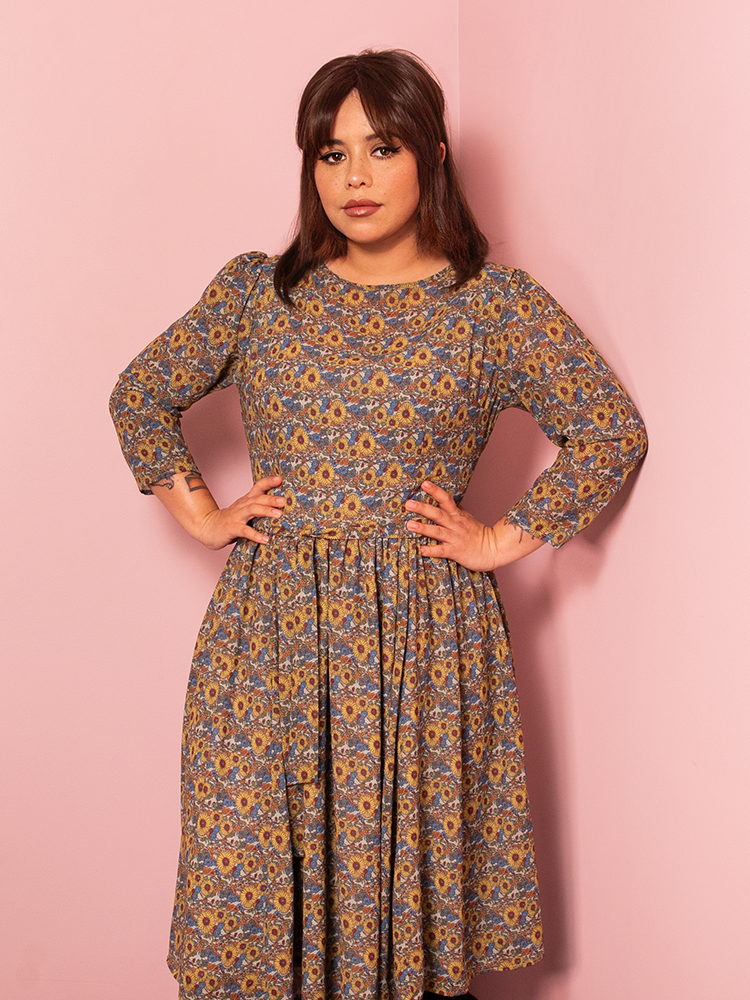The Astrid Vintage Floral Dress exudes a romantic, vintage Hollywood allure, with its elegant floral print and timeless silhouette, perfect for any occasion.