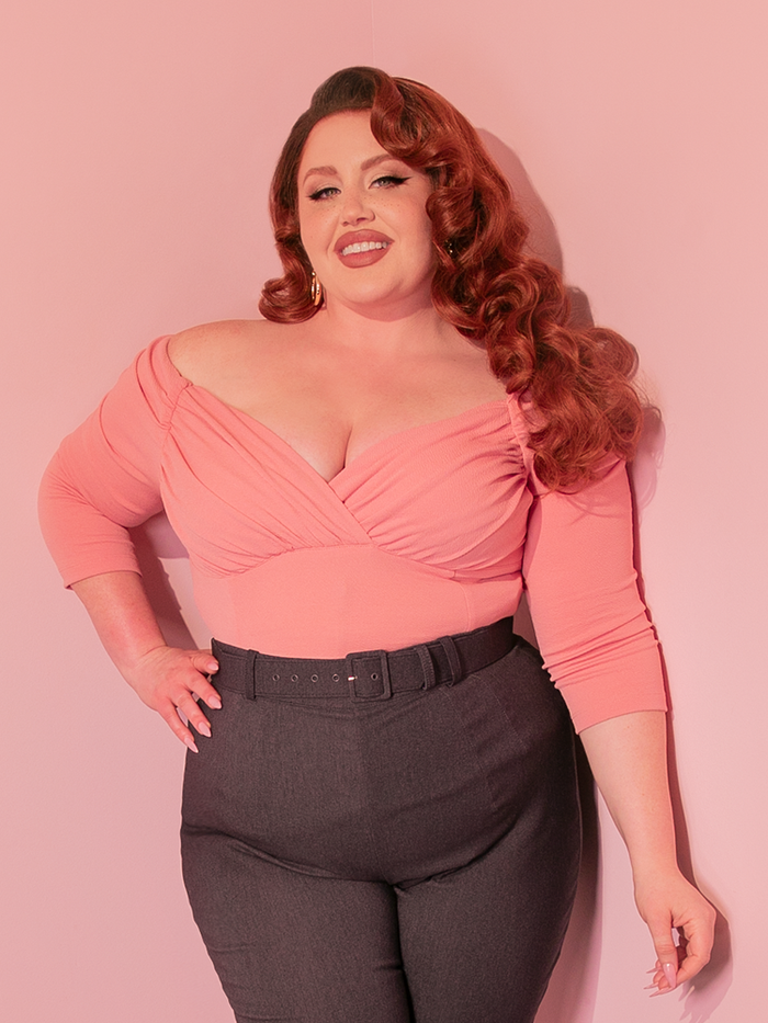 Slip into the Starlet Top in Baby Pink from Vixen Clothing, and channel the timeless elegance of 1950s Hollywood glamour with a modern twist that's as captivating as a classic film premiere.