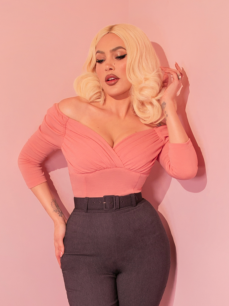 For those sunny brunch dates, the Starlet Top in Baby Pink paired with a flirty vintage skirt creates an ensemble that's as delightful as a sip of mimosa in a garden blooming with the charm of yesteryears.