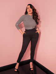 Sleek and sophisticated, these Cigarette Pants in Black Twill are a vintage-inspired wardrobe essential with a high-waisted fit and tailored silhouette perfect for achieving classic Hollywood style.

