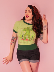 The Creature from the Black Lagoon™ Sweater Knit Short Sleeve Top combines retro charm with iconic horror, featuring a classic fit and a bold Lagoon Green hue.