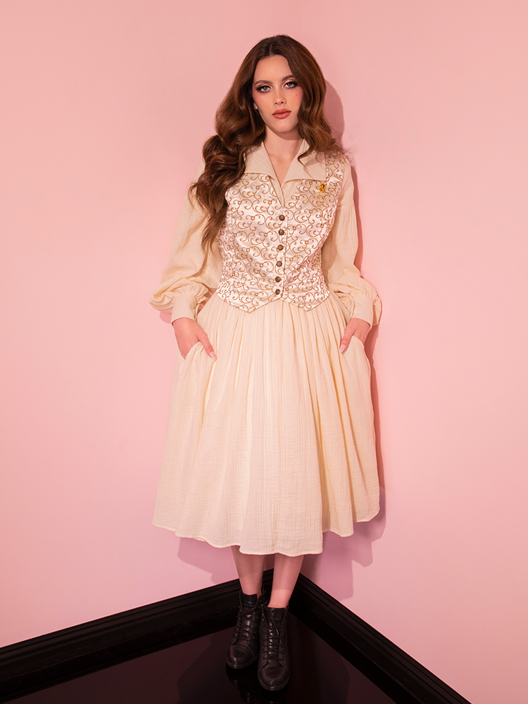 Embark on a journey of elegance with the all new Cream Fantasy Shirtdress, harmonized by a Faux Leather Belt, as modeled by our retro muse from Vixen Clothing.