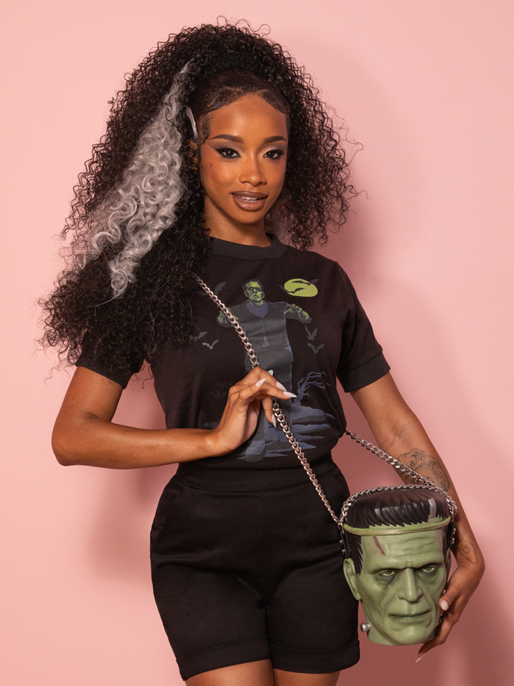 Unisex black knit top with a striking graphic of Frankenstein’s monster woven across the chest.