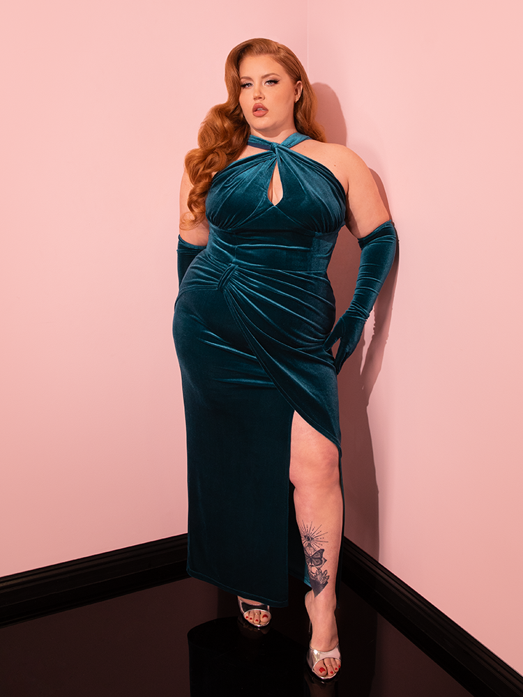 Stunning vintage models gracefully present the Golden Era Gown and Glove Set in Teal Velvet from Vixen Clothing, showcasing a range of poses.