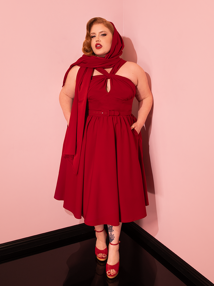 Vixen Clothing's Ruby Red Golden Era Swing Dress and Scarf steal the spotlight as stunning vintage models present a variety of poses.