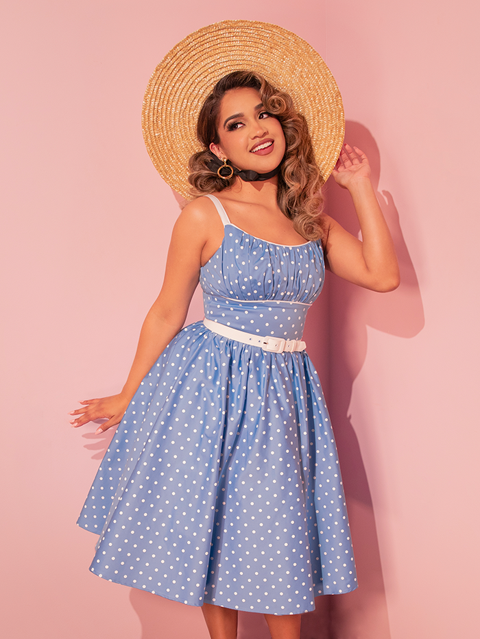 Dance into vintage charm with the Ingenue Swing Dress in Light Blue with White Polka Dots, a retro-inspired dress perfect for any occasion.