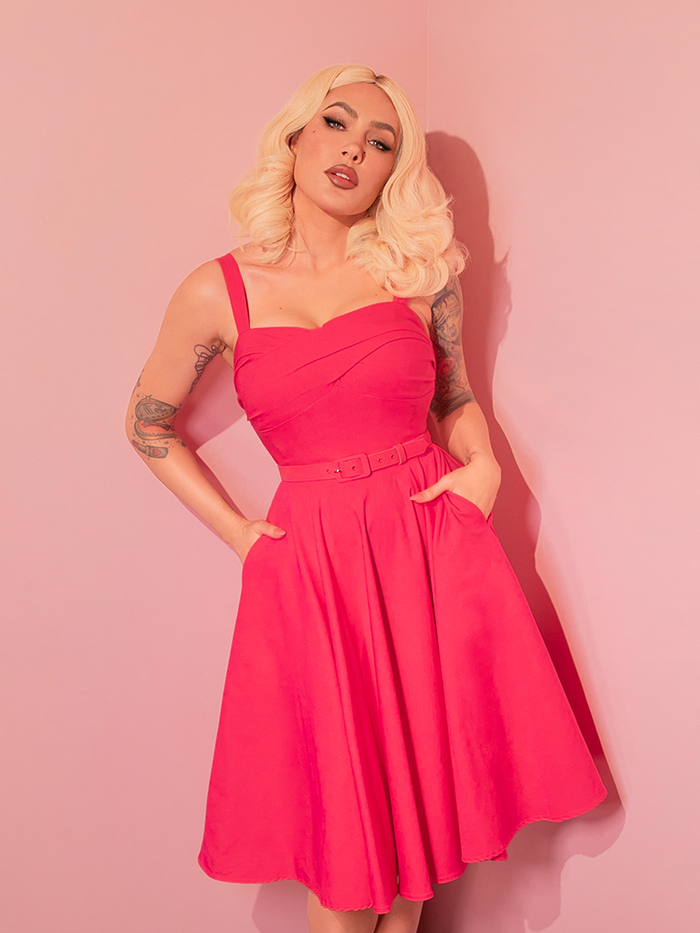 The Jawbreaker Swing Dress in hot pink is a stunning ode to the fearless femininity that vintage clothing embodies, designed for the woman who loves to make an entrance.