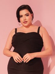 The Jawbreaker Top in Black transforms your look with a hint of retro rebellion, perfect for pairing with high-waisted vintage jeans.