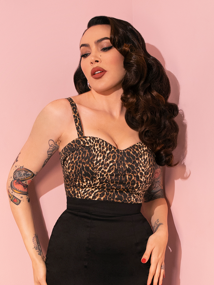 The iconic Maneater Top in Wild Leopard Print graces Micheline Pitt's figure in a series of playful poses for Vixen Clothing.