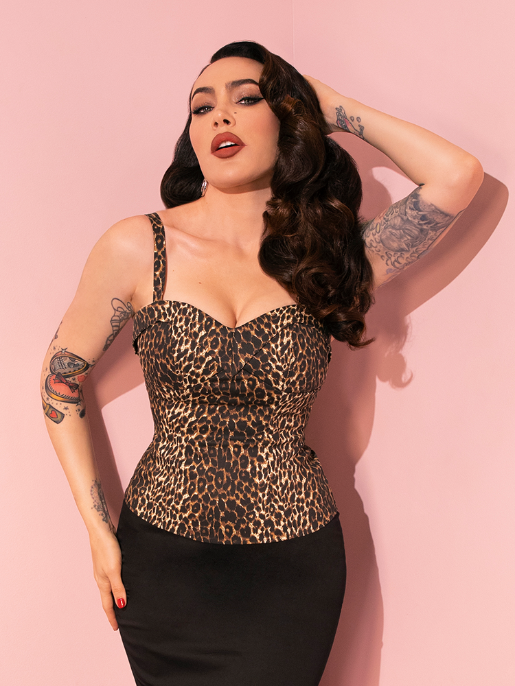 Micheline Pitt adds a playful touch to her look, posing in the Wild Leopard Print Maneater Top from the iconic retro brand, Vixen Clothing.