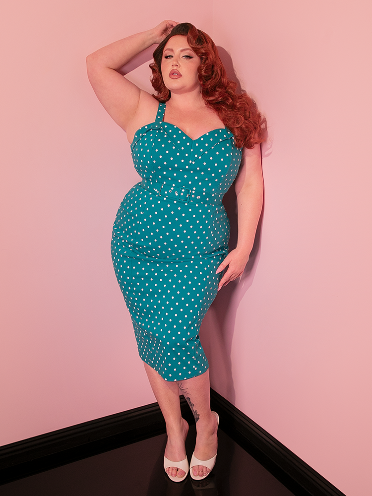 Step back in time with the Maneater Wiggle Dress, a classic piece that pairs the fun of Teal Blue Polka Dots with the allure of a snug, figure-emphasizing cut.
