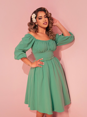 Embrace effortless style with this vacation dress in moss green, perfect for a chic and relaxed look.