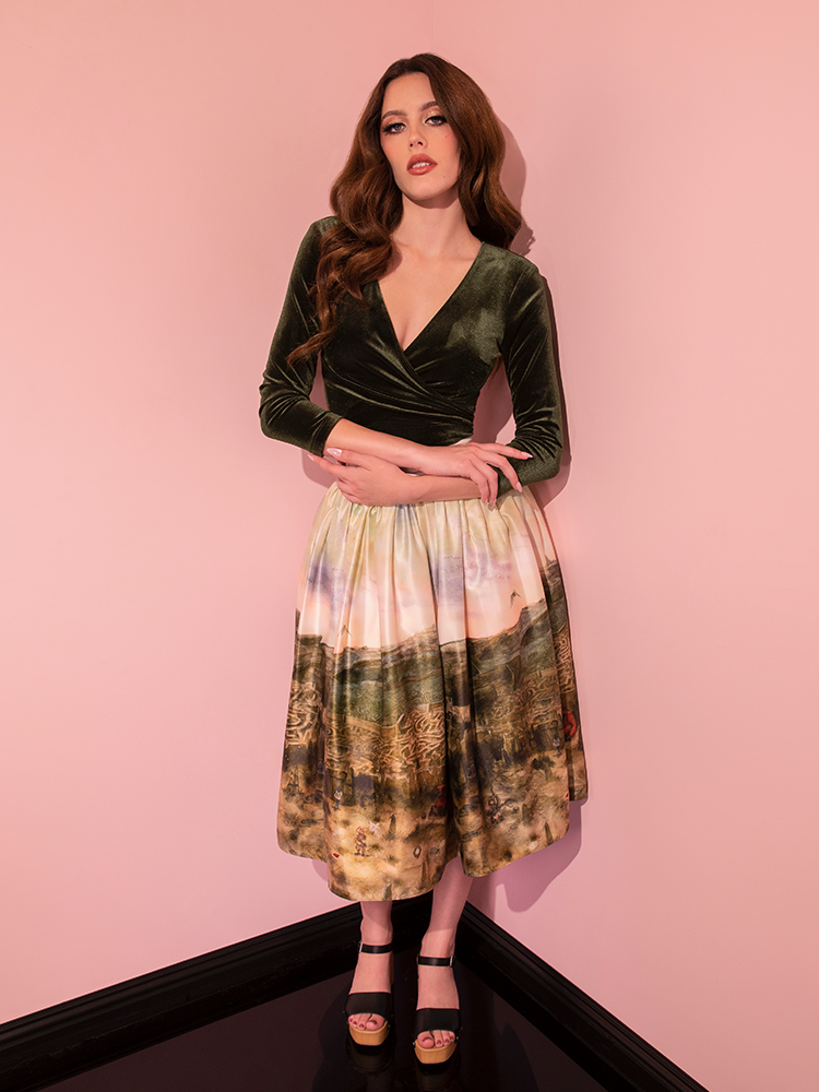 The LABYRINTH™ Renaissance Skirt and the accompanying Labyrinth Watercolor Print, both from Vixen Clothing's retro collection, create a memorable vintage fashion moment on this model.