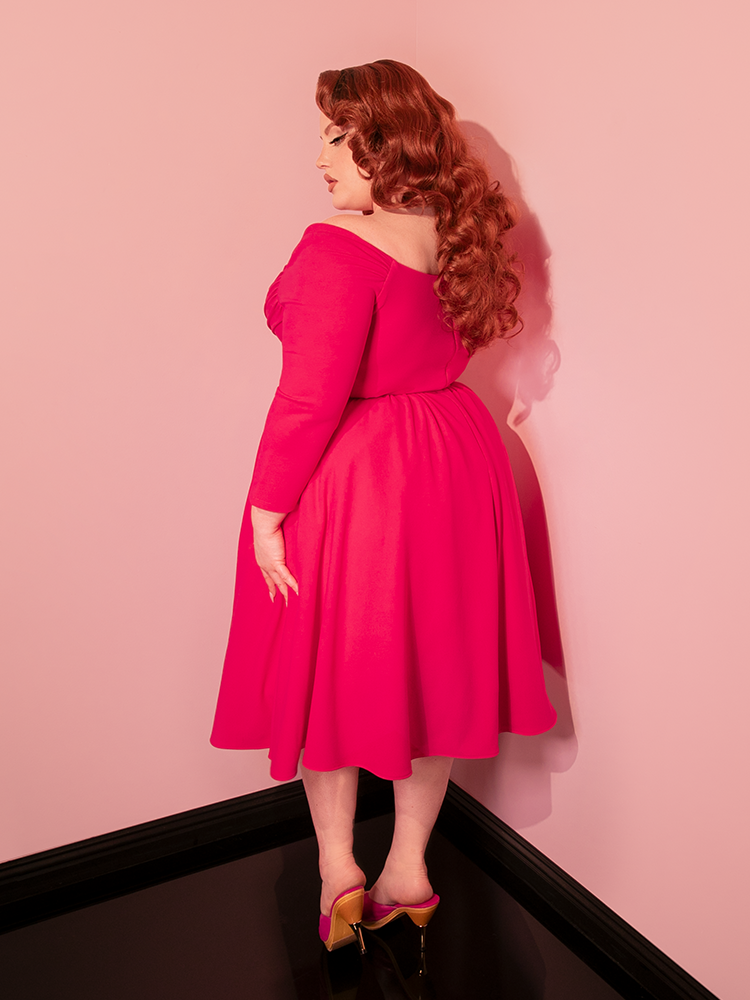 Revive the glamour of retro dresses with the Starlet Swing Dress in Fuchsia from Vixen Clothing. This striking piece not only pays homage to the past with its design but also brings a touch of modernity with its vibrant fuchsia hue, making it a beloved choice for modern-day vintage lovers.
