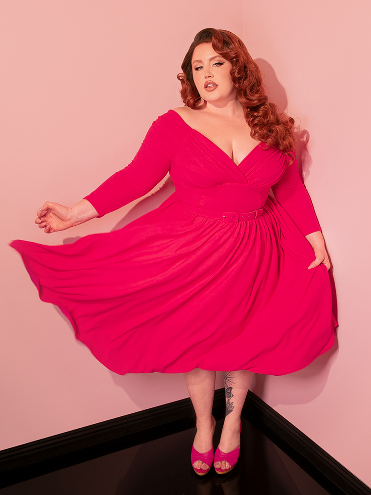 Make a statement in the world of vintage clothing with the Starlet Swing Dress in Fuchsia by Vixen Clothing. Its stunning color and retro-inspired design make it a perfect choice for those who love to stand out in timeless style.