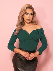 The Starlet Top in hunter green appears as a vintage clothing essential, defined by its rich color and softly structured, classic Hollywood elegance.