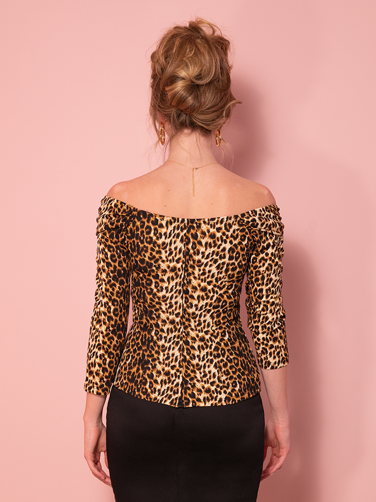 The Starlet Top in leopard print with old Hollywood glamour, shown against a pink background.