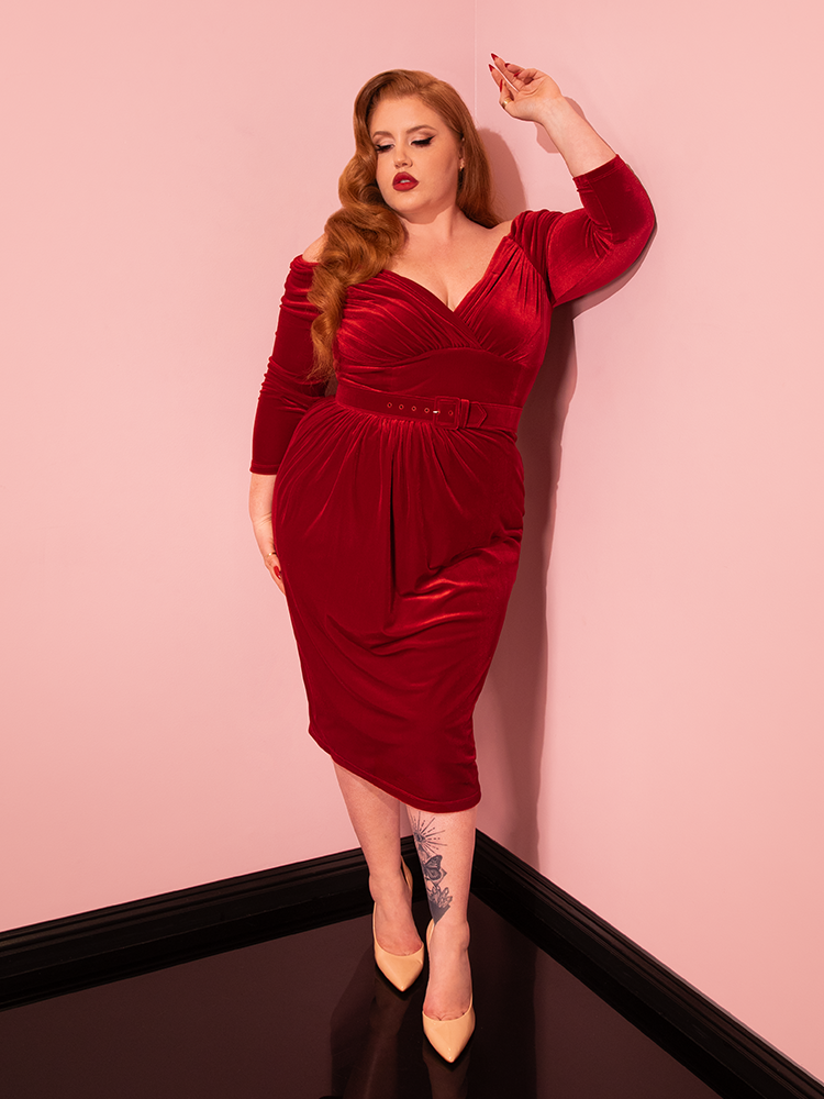 Experience the epitome of retro chic with Vixen Clothing's Starlet Wiggle Dress in Ruby Red Velvet. Witness the grace and beauty of this vintage ensemble as it steals the spotlight on the runway.
