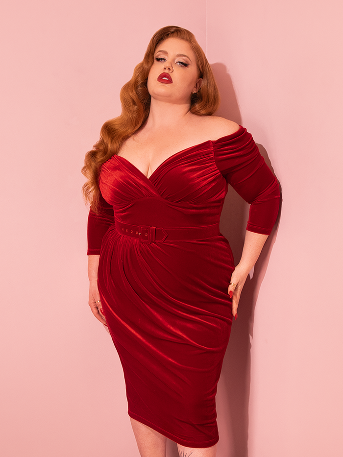 Step into the glamour of the past with Vixen Clothing's Starlet Wiggle Dress in Ruby Red Velvet. Watch as stunning vintage models bring this retro masterpiece to life on the runway.