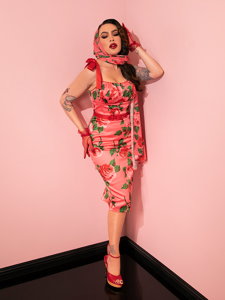 The stunning retro clothing model flaunts the 1950s Satin Wiggle Sundress and Scarf in Pink Vintage Roses from the vintage brand Vixen Clothing.