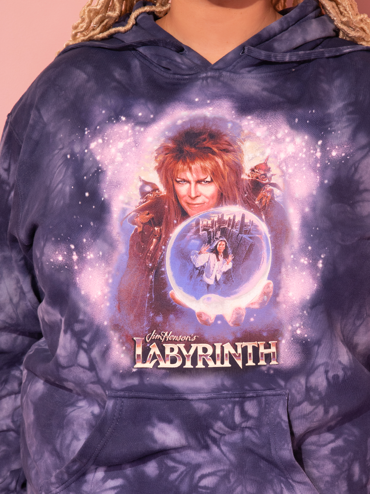 Our stunning model adorns the Midnight Blue Tie Dye LABYRINTH™ Goblin King Hoodie, a masterpiece from the Vixen Clothing retro collection.