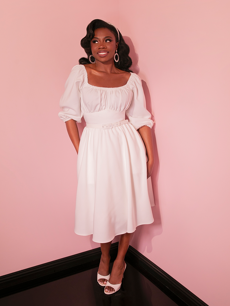 Capture the nostalgic feel of vintage dresses with the Vacation Dress in Ivory, a must-have for any woman who appreciates the sophistication of retro style.