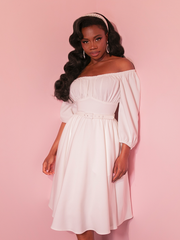 Stroll through your summer getaway in the Vacation Dress in Ivory, a retro-inspired gown that exudes timeless elegance and understated charm.