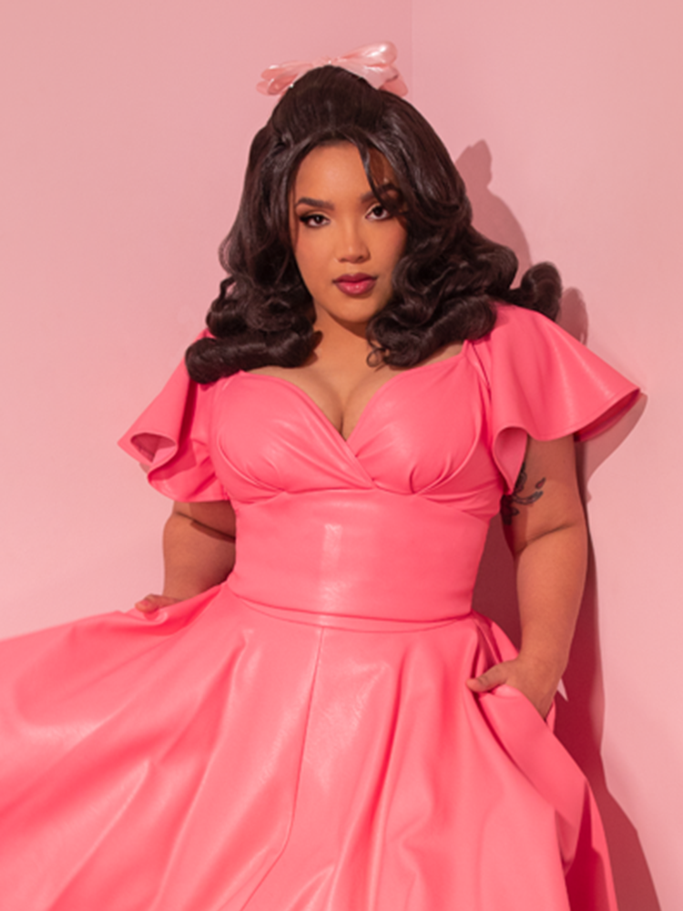 Cast your eyes upon the gorgeous gal, rocking the Bad Girl Babydoll Crop Top - a knockout piece from the latest retro-inspired lineup by Vixen Clothing.