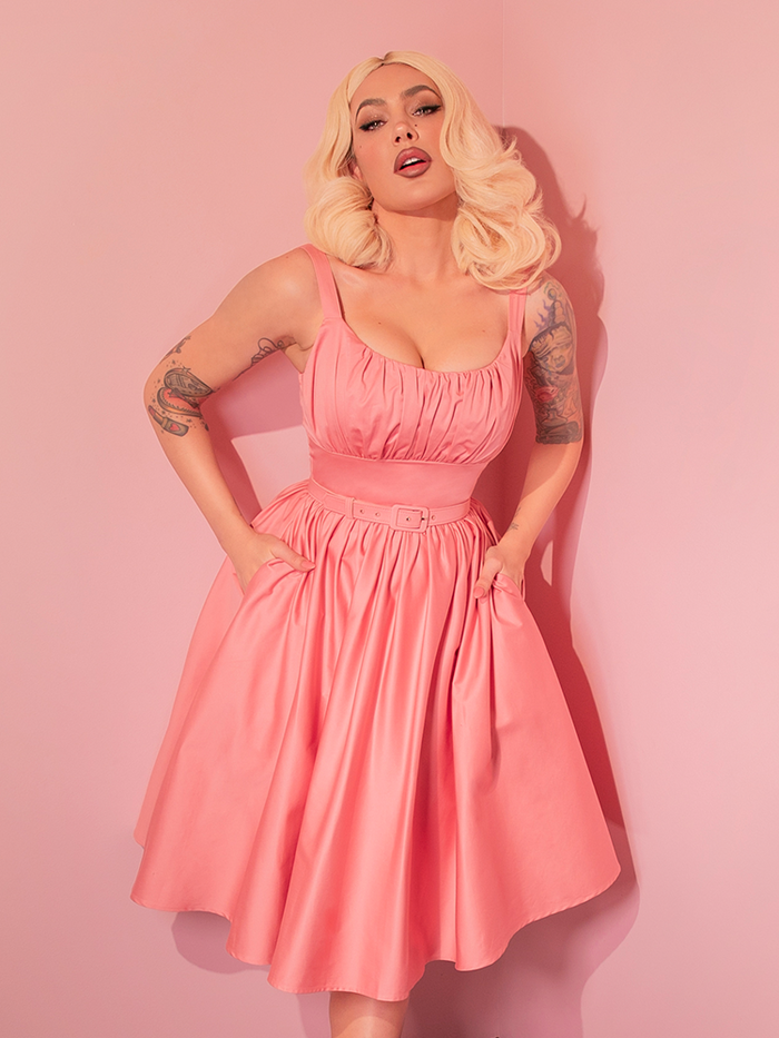 Step into classic elegance with the Ingenue Swing Dress in Blush Pink, a retro-inspired dress that twirls with timeless charm.