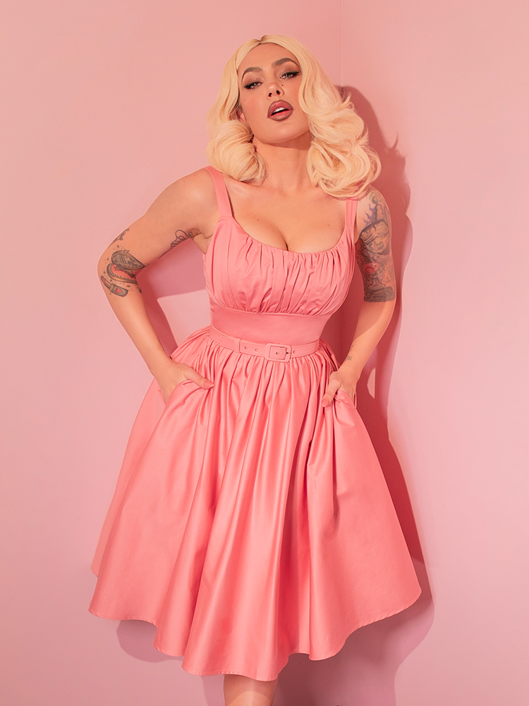 Step into classic elegance with the Ingenue Swing Dress in Blush Pink, a retro-inspired dress that twirls with timeless charm.