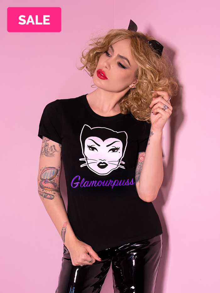 Micheline Pitt, channeling her inner Catwoman, shows off the Glamourpuss t-shirt from Vixen Clothing.