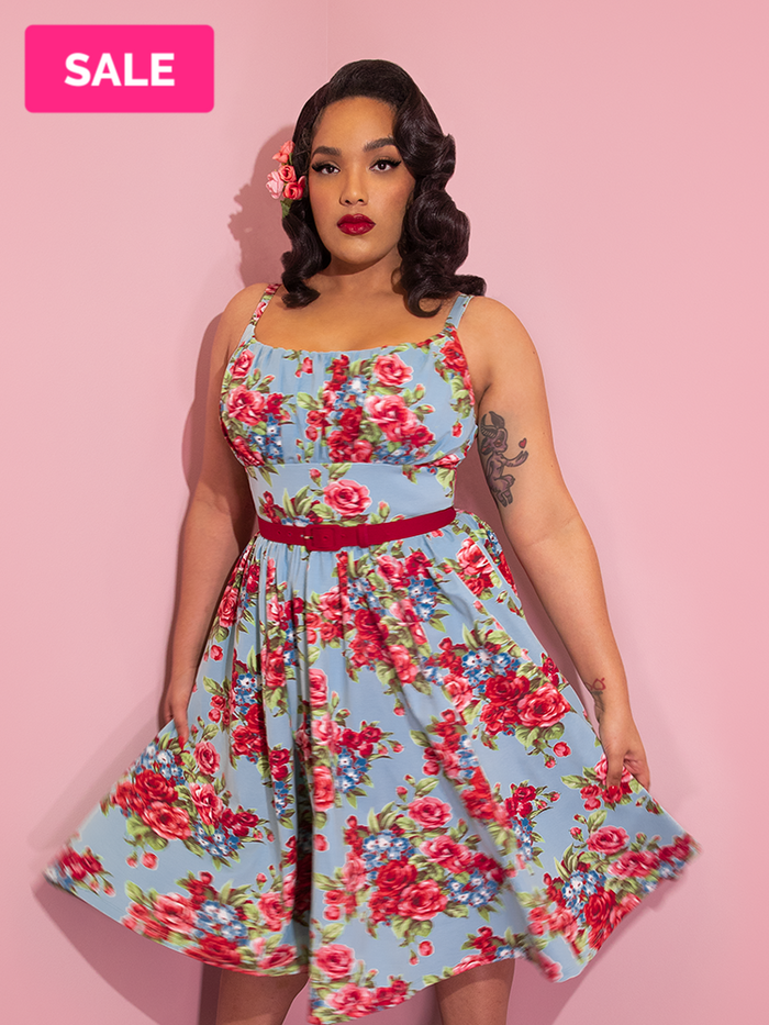 A closeup of Ashleeta with flowers in her hair modeling the Vixen Clothing Ingenue dress.
