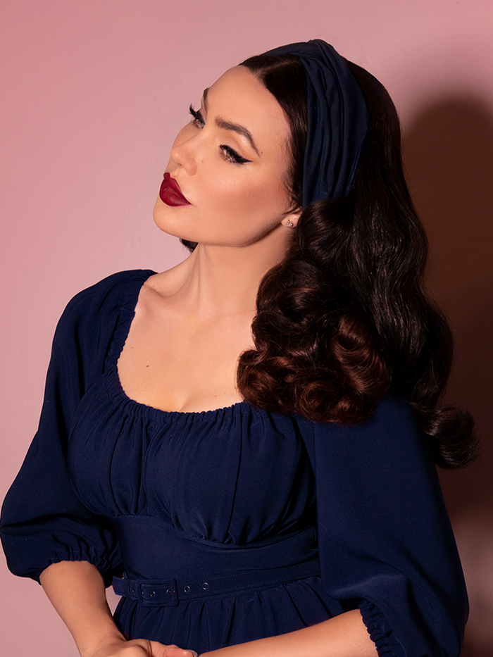 Micheline Pitt modeling the new Vintage Style Knot Headband in Navy from Vixen Clothing.