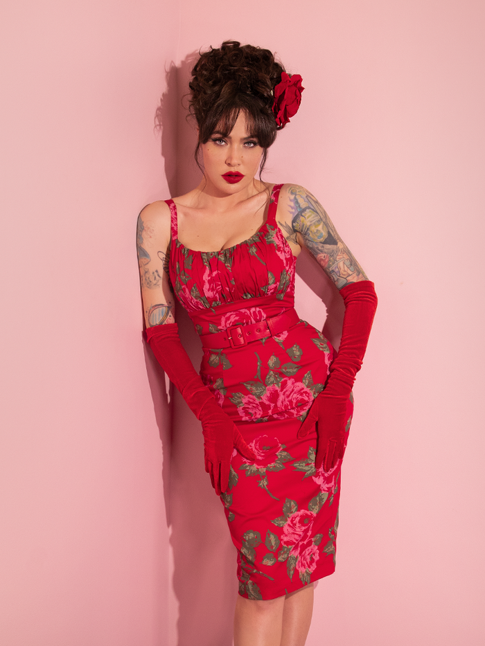 Micheline Pitt poses in the Ingenue Wiggle Dress in Vintage Red Rose Print.